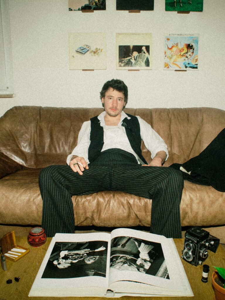photographer sitting on couch after long day of work