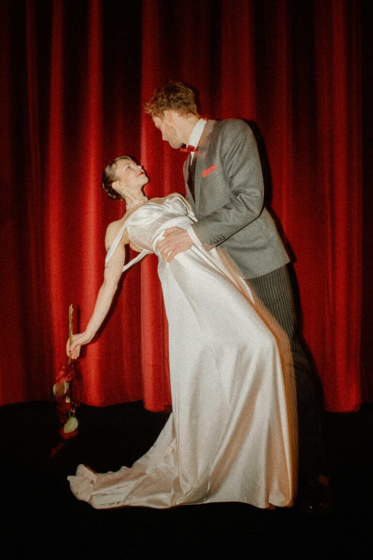 dance pose of couple with rose in analog film tones