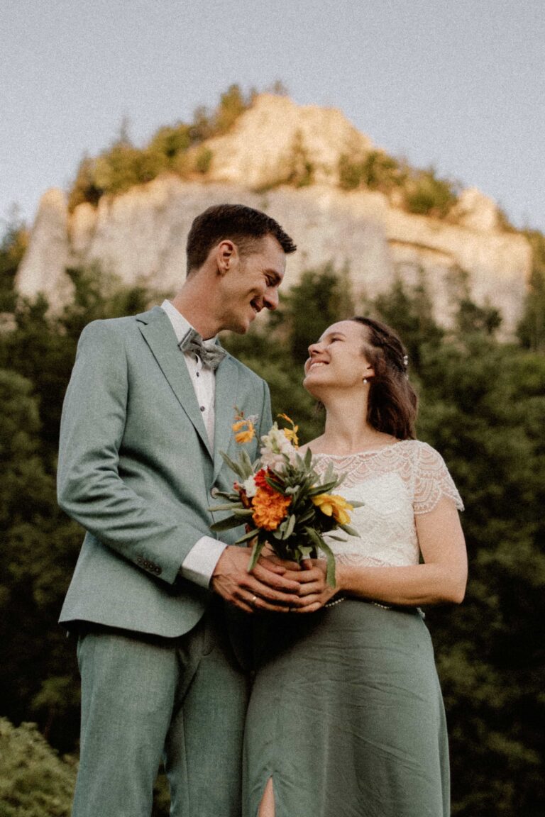 wedding couple infront of mountain in golden hour