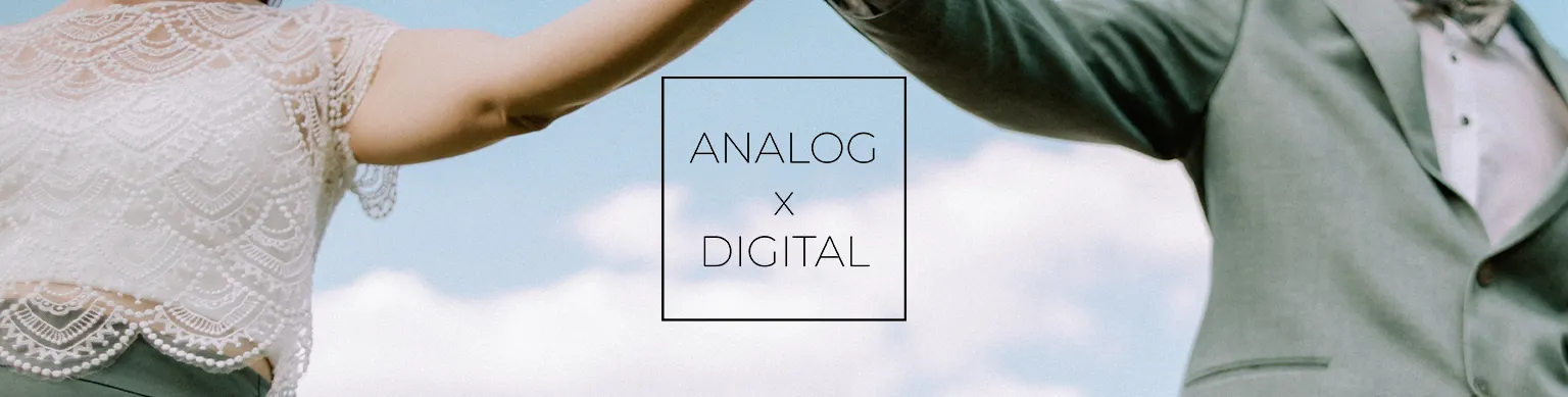 couple holding hands with sky in backround