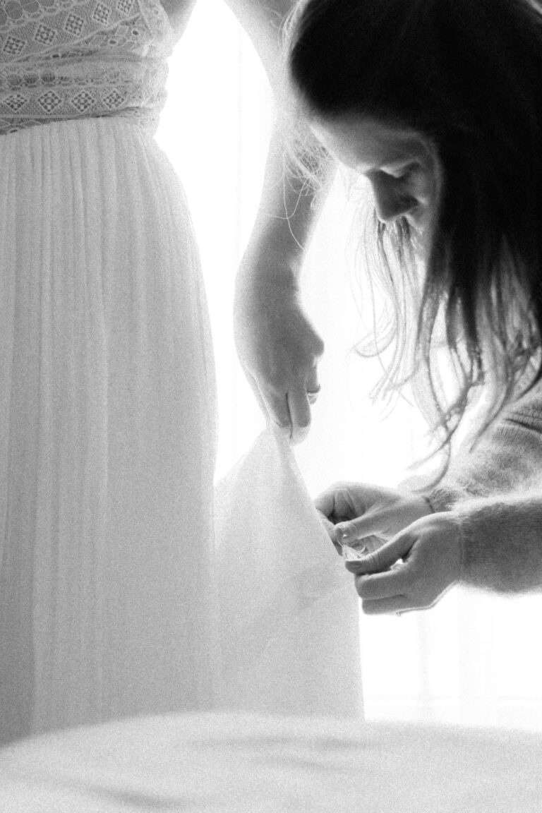 last dress adjustments for bride in vintage black and white