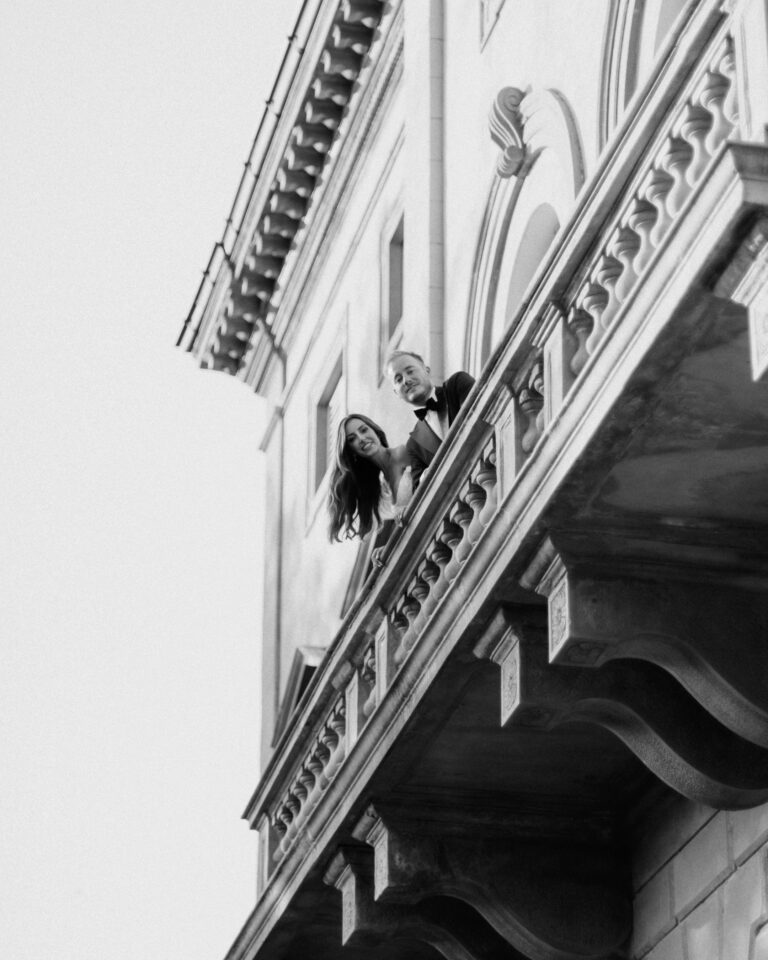 couple on balcony of villa