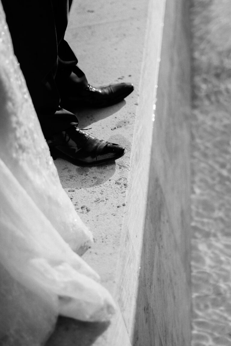 bride and groom by the pool